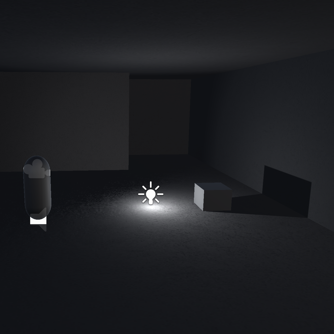 Image of the player capsule, a point light, and a cube in a dark room